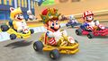 Various Mario costumes driving on the T variant of the course