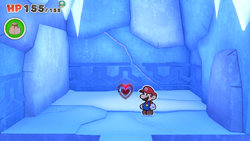 Mario standing near a Healing Heart on Ice Vellumental Mountain of The Origami King.