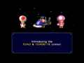 The unlock screen of the Toad and Toadette Combo from Mario Kart Double Dash!! Toad is standing on the left, Toadette is standing on the right, with the Toad Kart in the middle. A blue text box is below them saying "Introducing the TOAD and TOADETTE combo!"