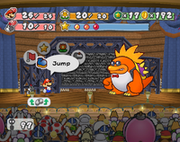 Mario and his partners battling Macho Grubba.