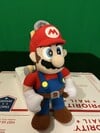 A plushie of Mario and FLUDD from Super Mario Sunshine by BD&a