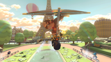 Donkey Kong tricking while gliding near the Eiffel Tower on Tour Paris Promenade
