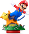 An amiibo figure of Mario using a Launch Star near a Luma