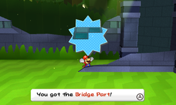 Mario getting a Bridge Part scrap after defeating a Spear Guy in Shy Guy Jungle of Paper Mario: Sticker Star.