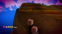 Mario falling down onto a set of Blocks to collect some Purple Coins in Honeyhive Galaxy.