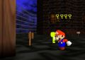 Mario collecting a key, with the "key counter" on the screen. (The "key counter" is stored in the game code, holding up to 6 characters)