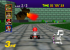 A Bowser Statue breathing fire onto the track in Mario Kart 64