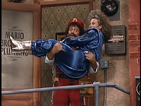 Mario holds E.C. in the "E.C. The Extra Creepy" live action segment of The Super Mario Bros. Super Show!