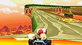 Toad racing on the ramp portion of the course in Mario Kart 7.