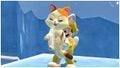 A calico kitten scratching while being carried by Mario