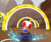 Thumbnail of the Toad Cup challenge from the 2020 Exploration Tour; a Ring Race challenge set on N64 Choco Mountain (reused as the Toad Cup's bonus challenge in the Toad vs. Toadette Tour)