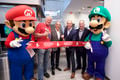 Mario, Luigi, Charles Martinet and the NOA executives during the opening of the renovated Nintendo New York