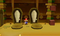 Mario near two opened coffins containing a Heart and a Hopslipper Sticker in Sandshifter Ruins of Paper Mario: Sticker Star.
