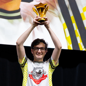 Photograph of player "Panda", winner of the Mario Kart 8 Deluxe: AU/NZ Championship 2024 Finals, raising his trophy