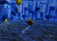 A set of yellow Banana Coins and a yellow Banana Balloon in Crystal Caves.