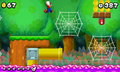 Mario jumping towards a cobweb next to a ! Switch and a Yellow Pipe.