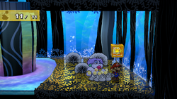 Mario next to the Shine Sprite in the bubble room in the Great Tree in the remake of the Paper Mario: The Thousand-Year Door for the Nintendo Switch.