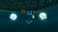 Mario fighting Kamella on the underground ghost ship.