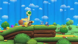 A Yoshi, next to a Shy Guy and an Egg Block, in Knitty Knotty Windmill Hill, from Yoshi's Woolly World.