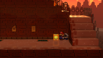 Mario next to the Shine Sprite in the sunset area of Riverside Station in the remake of the Paper Mario: The Thousand-Year Door for the Nintendo Switch.