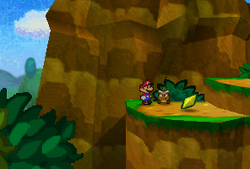 Mario finding a Star Piece on the platform in the scene to the west of Goomba Village in Paper Mario