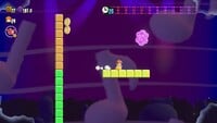 The second 10-flower coin in the level Fluff-Puff Peaks Special Climb to the Beat in Super Mario Bros. Wonder
