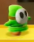 A green Shy Guy in Yoshi's Crafted World.