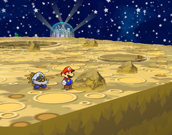 Mario near the rock containing a Power Punch on the Moon of Paper Mario: The Thousand-Year Door.