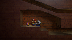 Mario near the P-Up, D-Down badge in Riverside Station of Paper Mario: The Thousand-Year Door for Nintendo Switch.