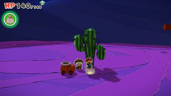 Mario standing near a glowing spot containing Flashy Boots (and on later visits, 100-Coin) in Scorching Sandpaper Far West of The Origami King.