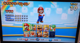 Don-chan's character select icon can be seen below Luigi's. Note that this character select screen is beta; the final screen has twelve character slots.