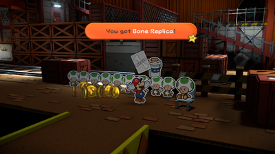 Mario being given a Thing Replica Card from the Foreman in Toad Trainworks of Paper Mario: Color Splash.
