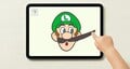 Luigi's moustache being pulled on an iPad