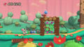 Yoshi next to a small log structure and a Bomb Guy.