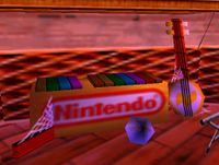 The musical instruments from the Banjo-Kazooie intro appearing in the background inside of Candy's Music Shop.