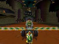 Bowser and Bowser Jr. prepare to do a Time Trial run at Bowser's Castle, using the Koopa King.
