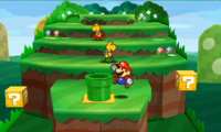 Screenshot of Mario, in a hilly, grassy area.