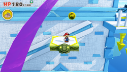 Mario standing near a 100-Coin in Sea Tower of The Origami King.