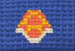 A Shell Patch in a yarn block.