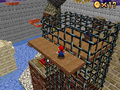 Mario beside a cage of wire nets in Wet-Dry World in Super Mario 64 DS