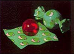 Super Mario RPG: Legend of the Seven Stars promotional artwork: Two pieces of Yoshi Candy, one wrapped, one opened