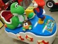 Super Mario Seesaw Takeover, a Japanese exclusive Super Mario-themed kiddie ride made by Banpresto and licensed by Nintendo for arcades. The machine's dimensions are 140 centimeters in height, 100 centimeters in width, and 170 centimeters in length.[17]
