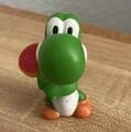 A finger puppet of Yoshi from Mario Party 7 by Tomy