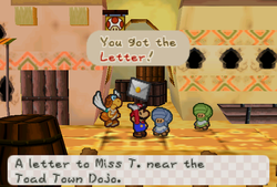 Mario receiveing a Letter from Mr. E in Dry Dry Outpost of Paper Mario.