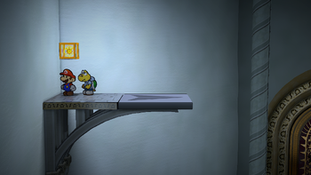 Mario next to the Shine Sprite above the left airplane panel before the Thousand-Year Door in the remake of the Paper Mario: The Thousand-Year Door for the Nintendo Switch.