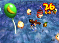 A green Banana Balloon and a setup for a Golden Banana for Chunky Kong in Crystal Caves.