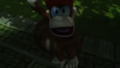 Diddy Kong fleeing from a large barrel.