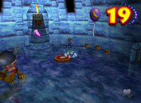 A purple Banana Bunch, purple Banana Balloon and a setup for a Golden Banana in Crystal Caves.