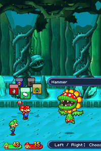 Mario, Luigi, Baby Mario and Baby Luigi battling Petey Piranha in Gritzy Caves