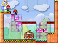 A screenshot of a Goal Door being activated in Room 1-7 in Mario vs. Donkey Kong: Minis March Again!